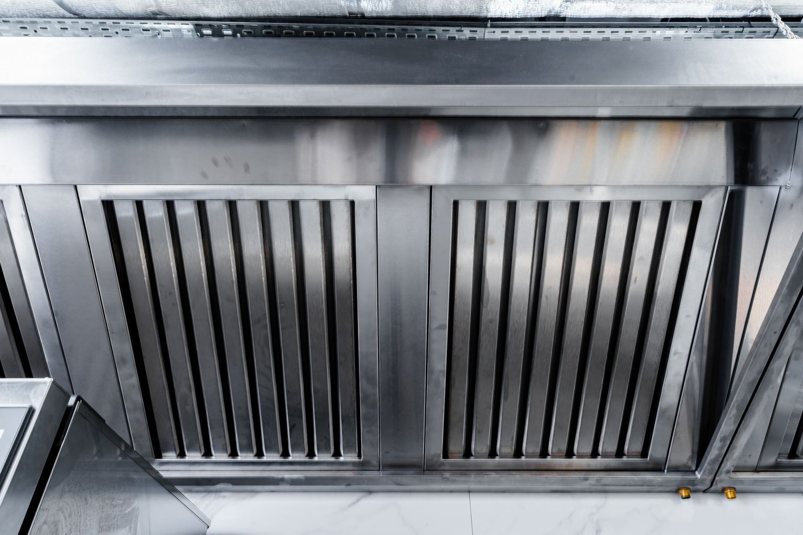 Type I commercial vent hood over a fryer line