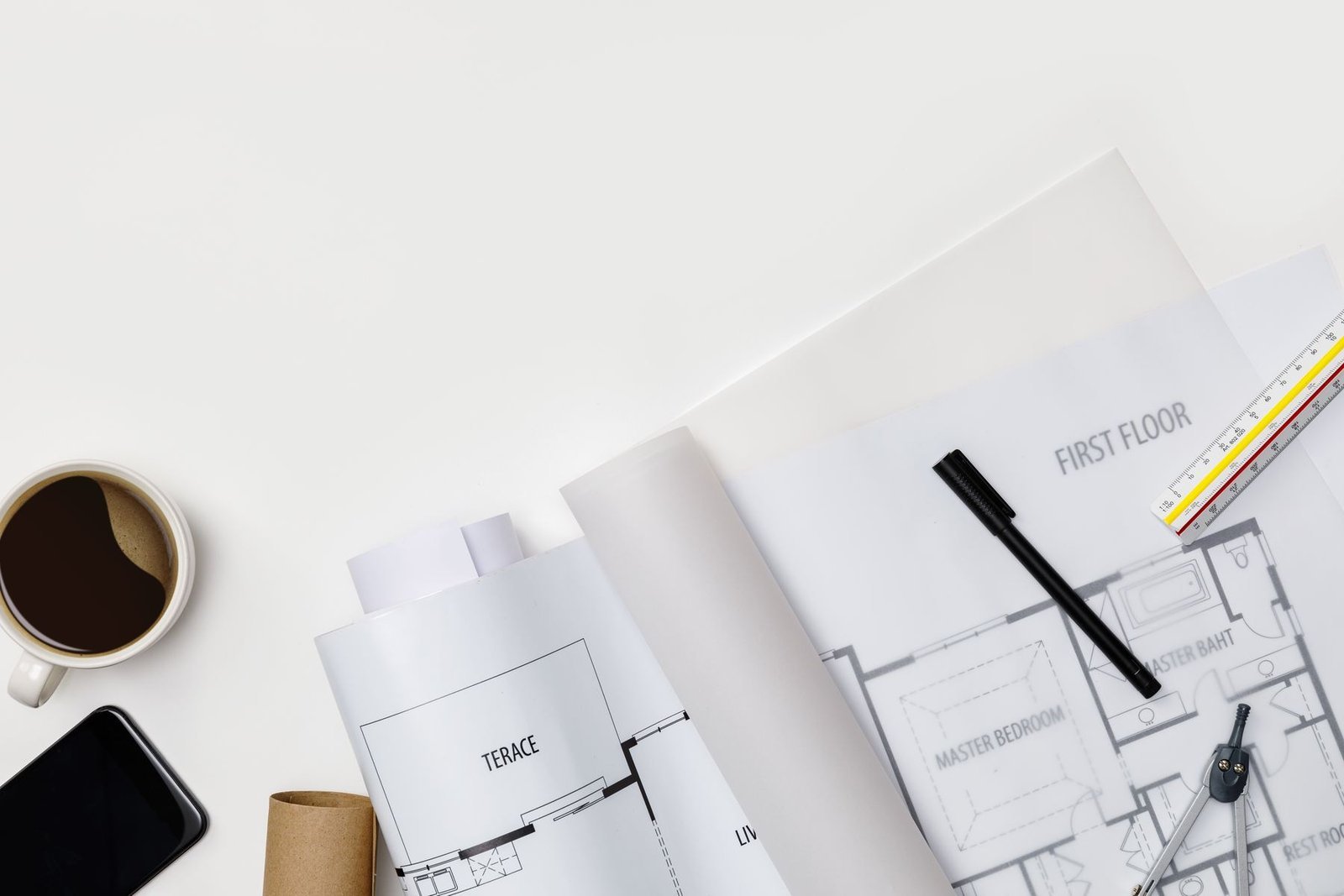 Lease document, floor plan and keys on a conference table